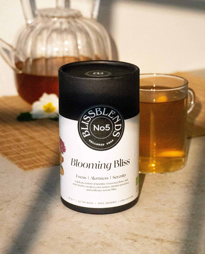 Blooming Bliss organic herbal tea served warm with honey – premium functional blend for mental focus, inner clarity, and grounded energy.