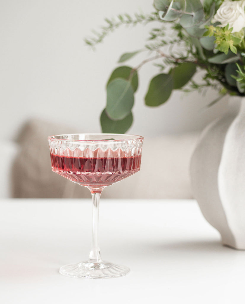 Organic period support tea by BlissBlends – calming infusion with raspberry leaf, lemongrass, and hibiscus for PMS relief, healing acne and stomach comfort.