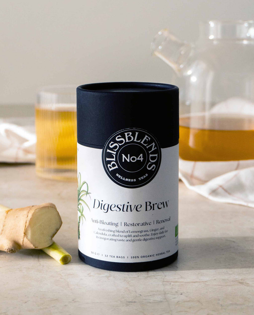 BlissBlends Digestive Brew No.4 anti-bloating tea placed beside fresh ginger. Organic herbs for stomach comfort, gut reset, and daily digestive balance.