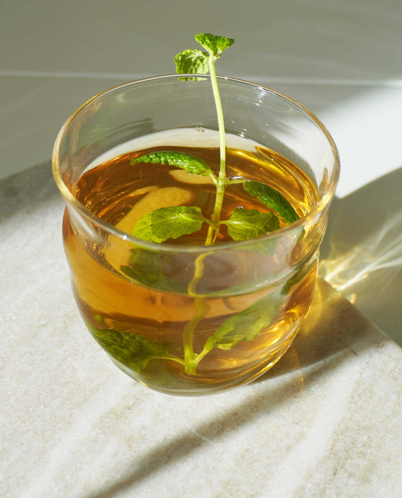Calming herbal tea blend with fresh mint leaves. I Need Calm No.3 is a soothing wellness tea for stress relief, emotional balance, and nervous system support.