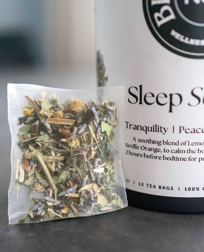 BlissBlends Sleep Serenity No.7 tea bag with whole dried passionflower, chamomile, and lemon balm. Pure organic sleep blend for grief relief, relaxation, and mind-body restoration.