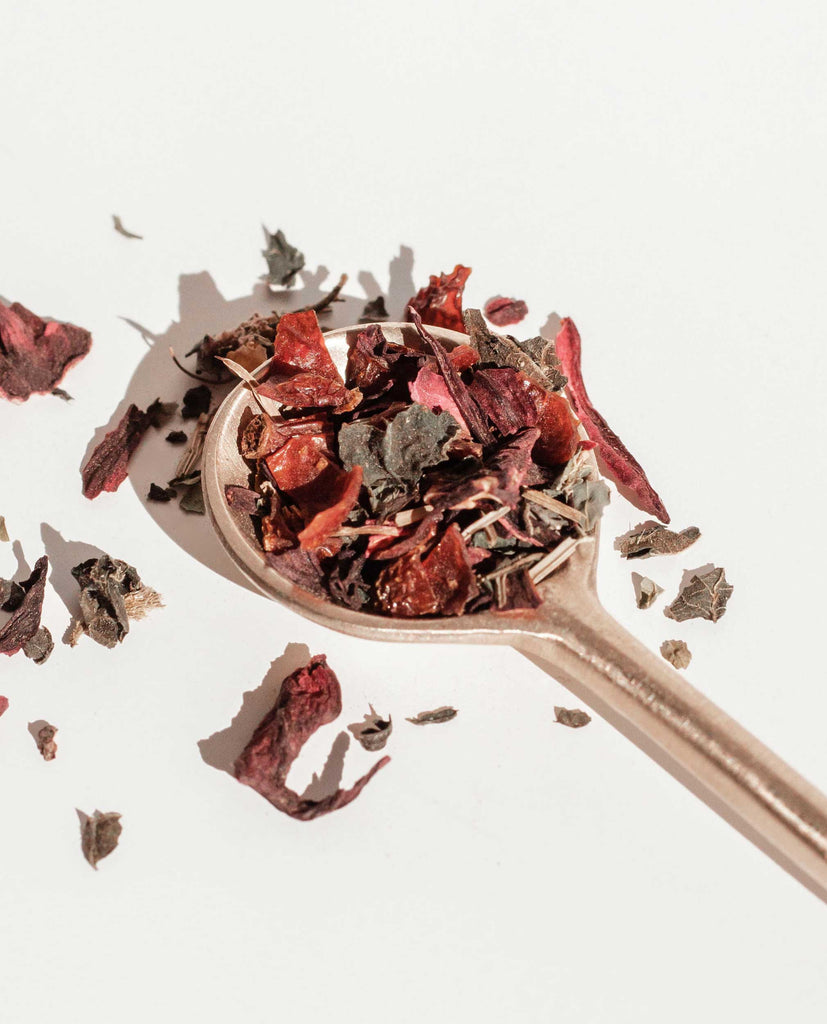 Organic herbal tea blend with hibiscus, rosehip, nettle, and horsetail – crafted for PMS, bloating, period pain, acne healing and gut reset.